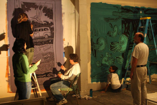 Projection paintings in progress with a crew of volunteers
