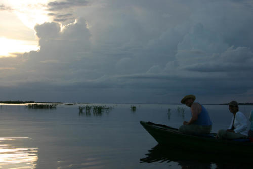 The water… like glass, storm clouds forming.